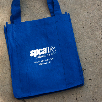 Blue tote bag with white spcaLA logo and text 'www.spcaLA.com (888) spcaLA1'