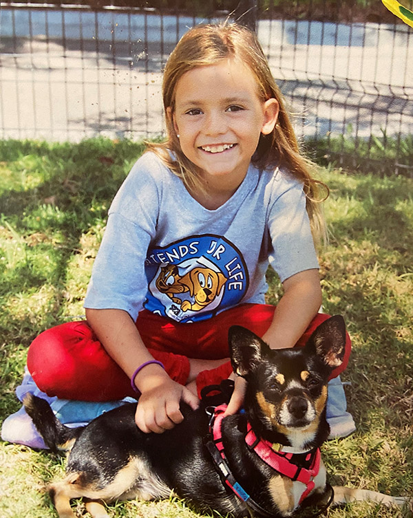 Blond child with brown and black dog