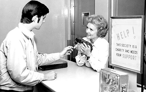 Betty Whote holding puppy
